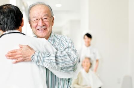 Man hugging physician